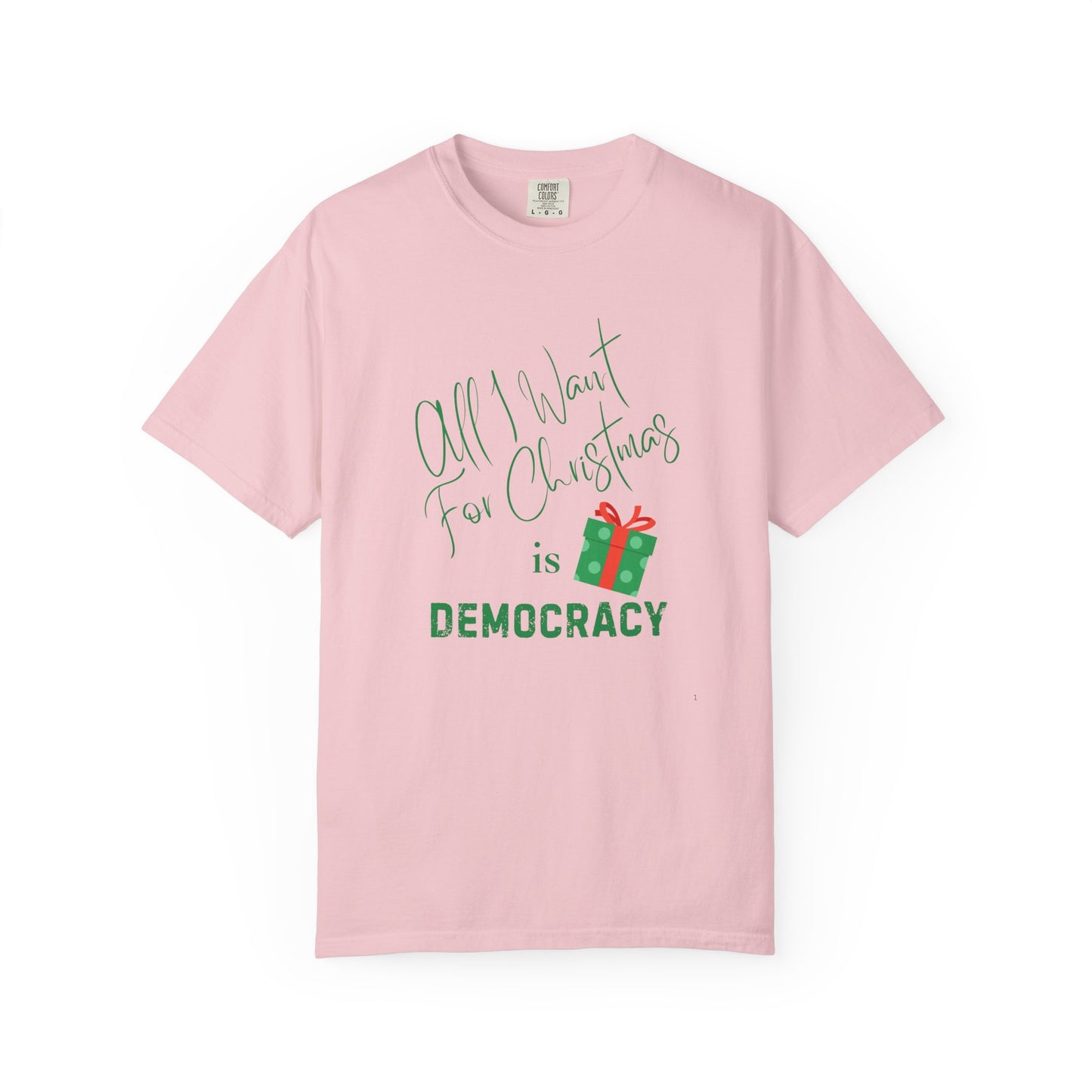 Pink t-shirt with Christmas-themed text and gift graphic on a white background