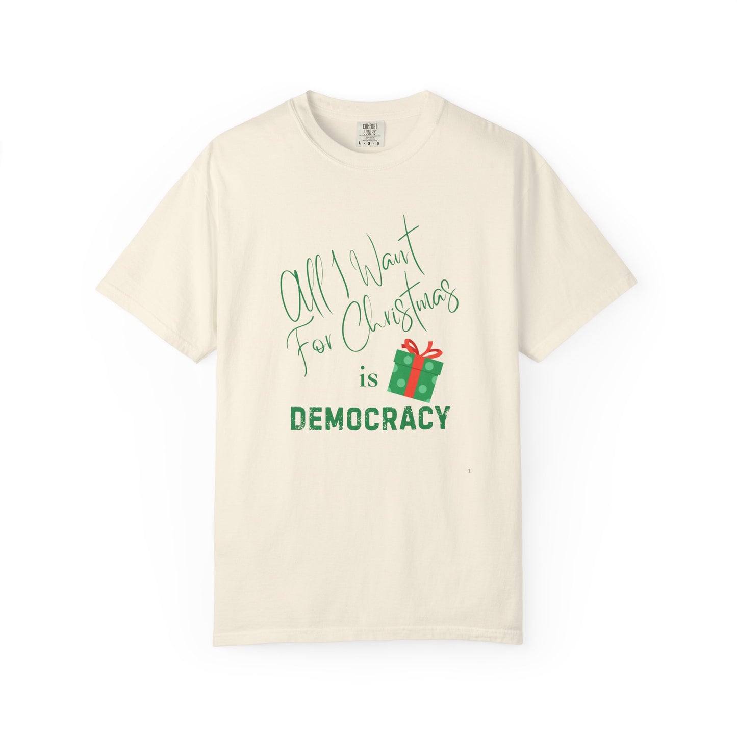 Beige t-shirt with Christmas-themed text and gift graphic on a white background