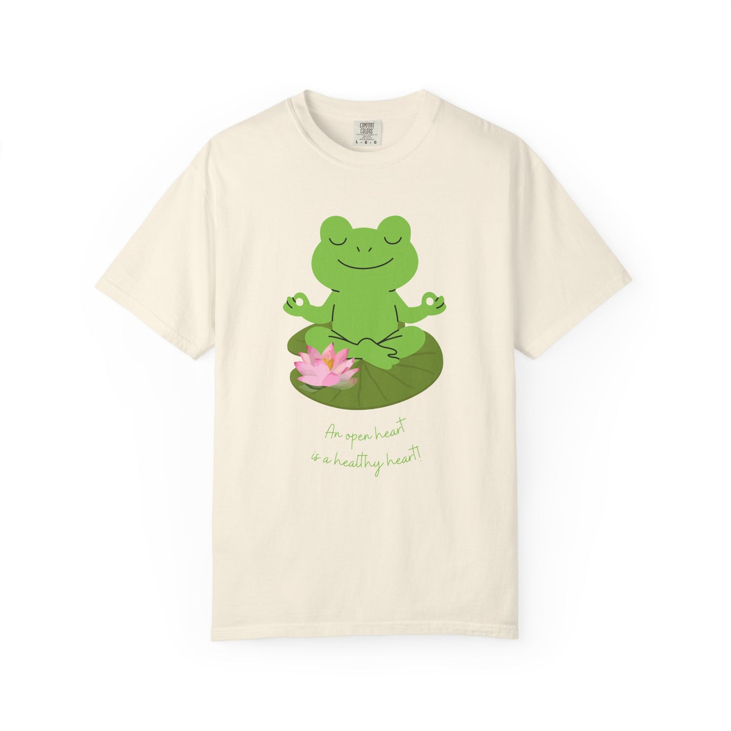 Beige t-shirt with a green frog on a lily pad design and text on a white background