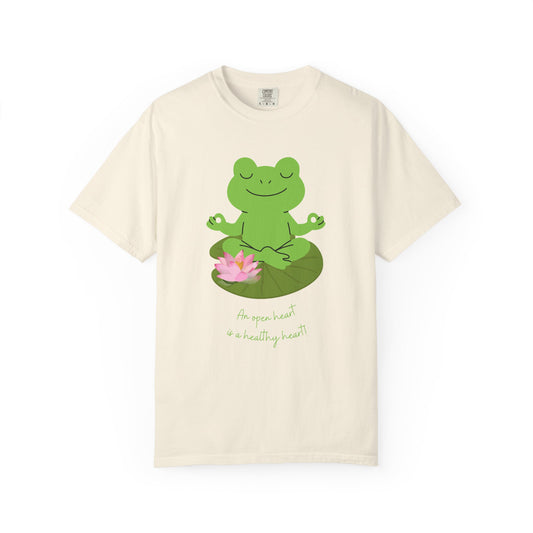 Beige t-shirt with a green frog on a lily pad design and text on a white background