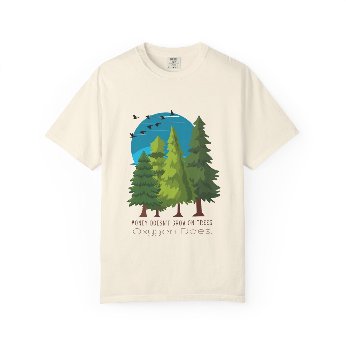Beige t-shirt with a graphic of trees and birds on a white background