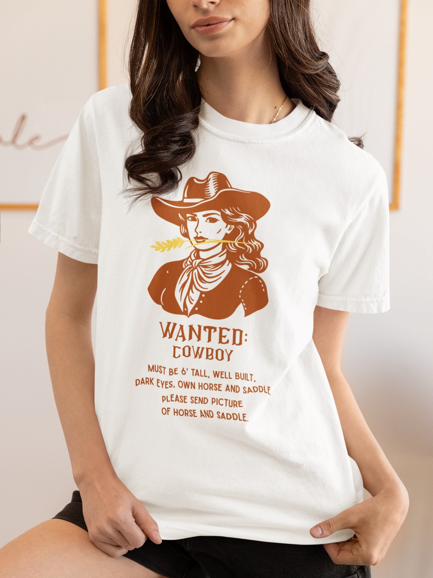 White T shirt with Wanted poster and cowgirl with funny saying on woman.