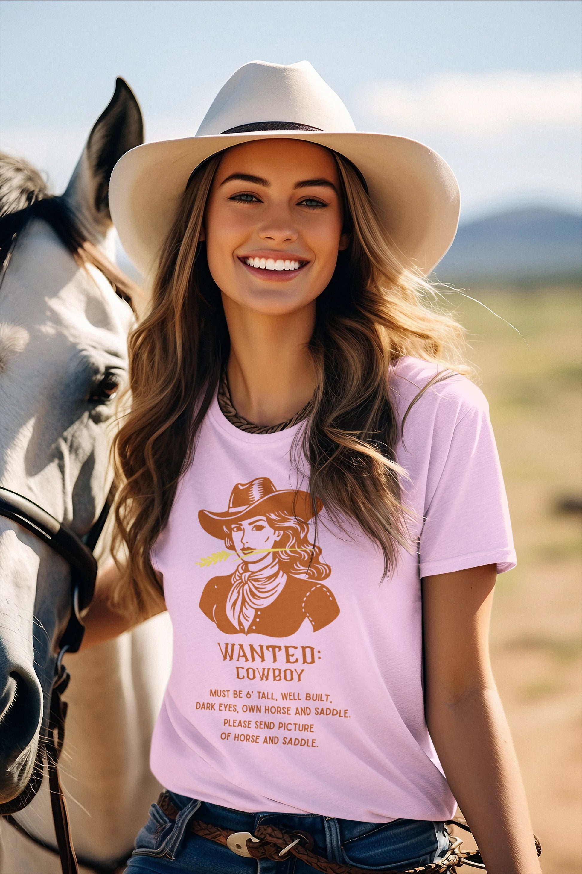 Pink T shirt with Wanted poster and cowgirl with funny saying on woman with horse.