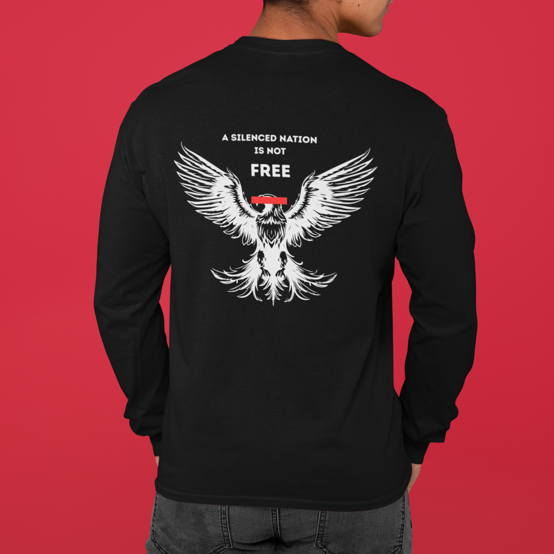 Black long-sleeve shirt with a white eagle design and text on the back, against a red background.