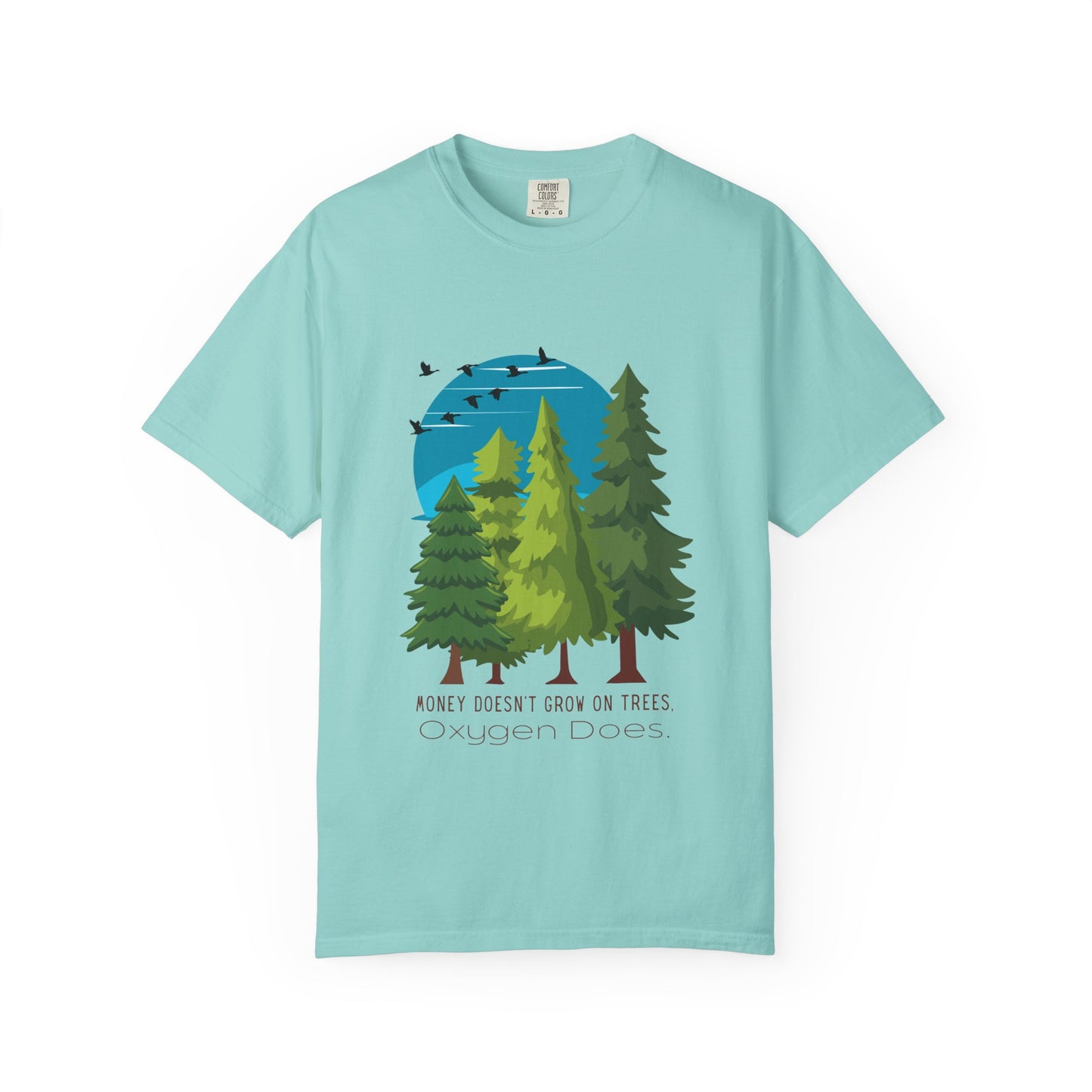 Light blue t-shirt with a graphic of trees and a blue circle, on a white background.