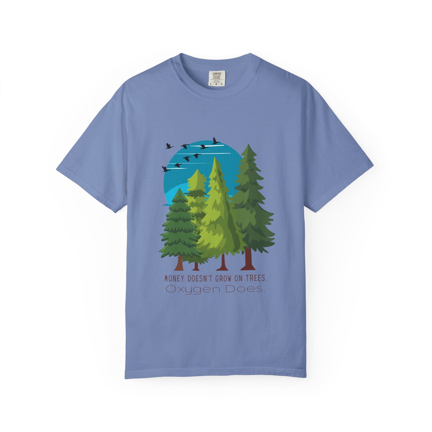 Blue t-shirt with a graphic of trees and birds on a white background