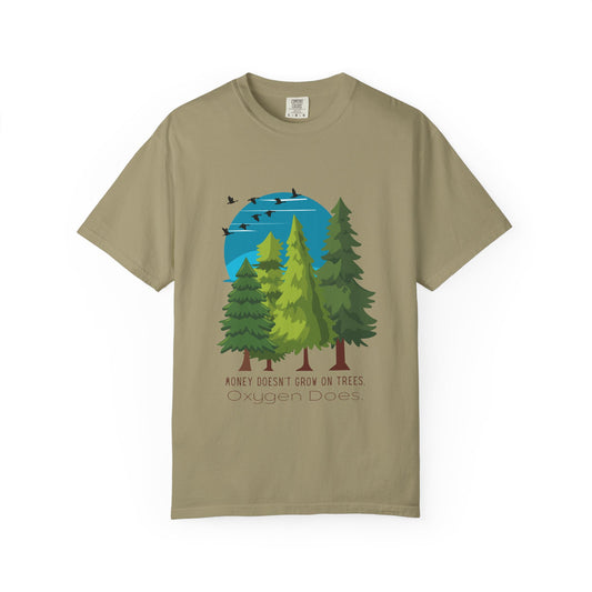 Beige t-shirt with a graphic of trees and a blue sky on a white background