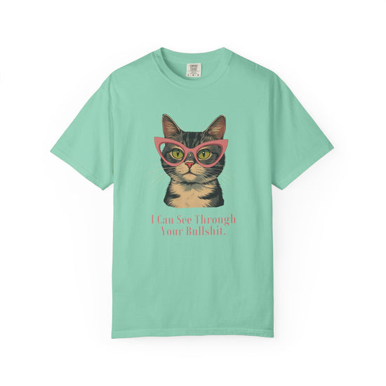 Mint Green short-sleeve t-shirt with a graphic of a tabby cat wearing pink glasses and the text 'I Can See Through Your Bullshit.' printed below, displayed on a clean white background.