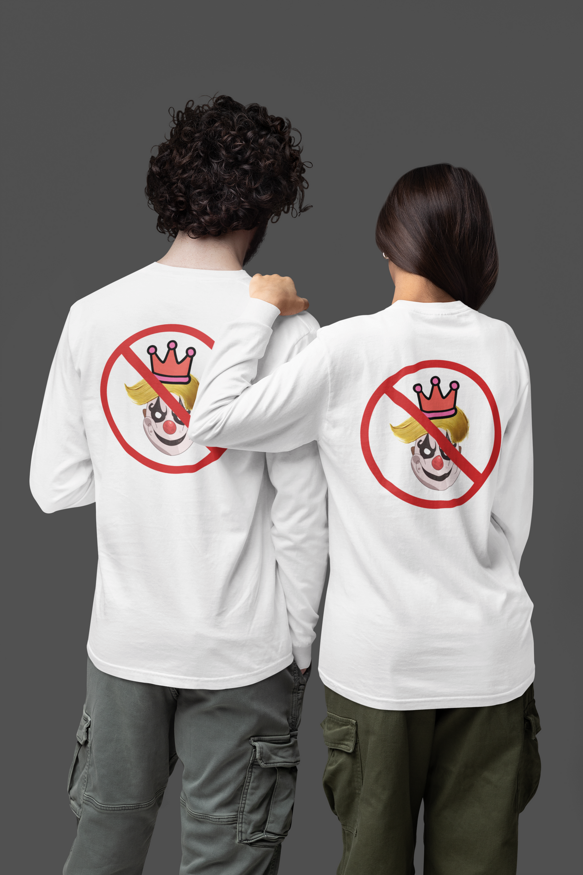 A dark charcoal gray and a white long-sleeve t-shirt with a graphic print on the back. The graphic features a clown face with yellow hair and a pink crown, overlaid with a red prohibition symbol (circle with a diagonal slash). 
