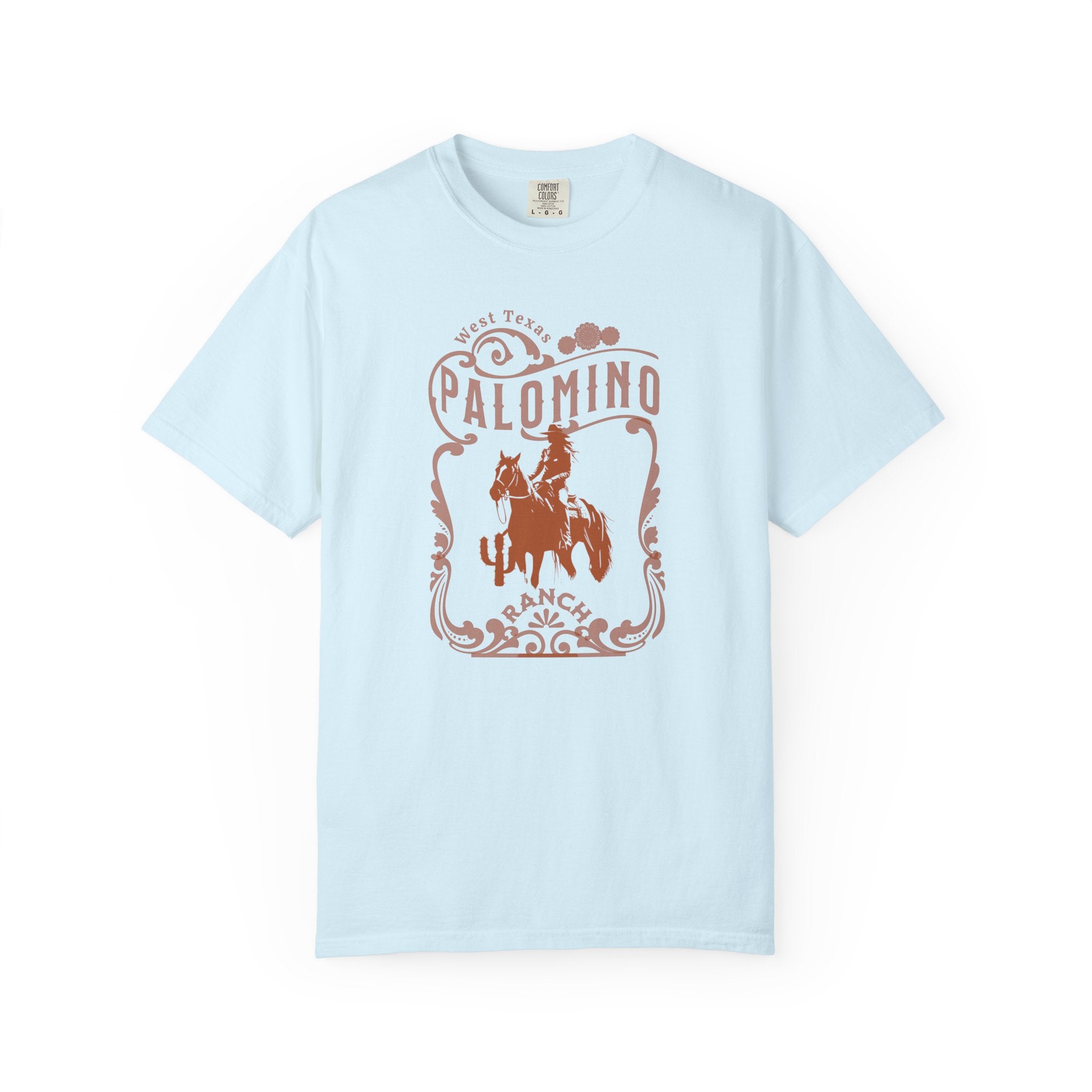 Light blue t-shirt with a graphic design of a horse and rider, and 'Palomino Ranch' text 
