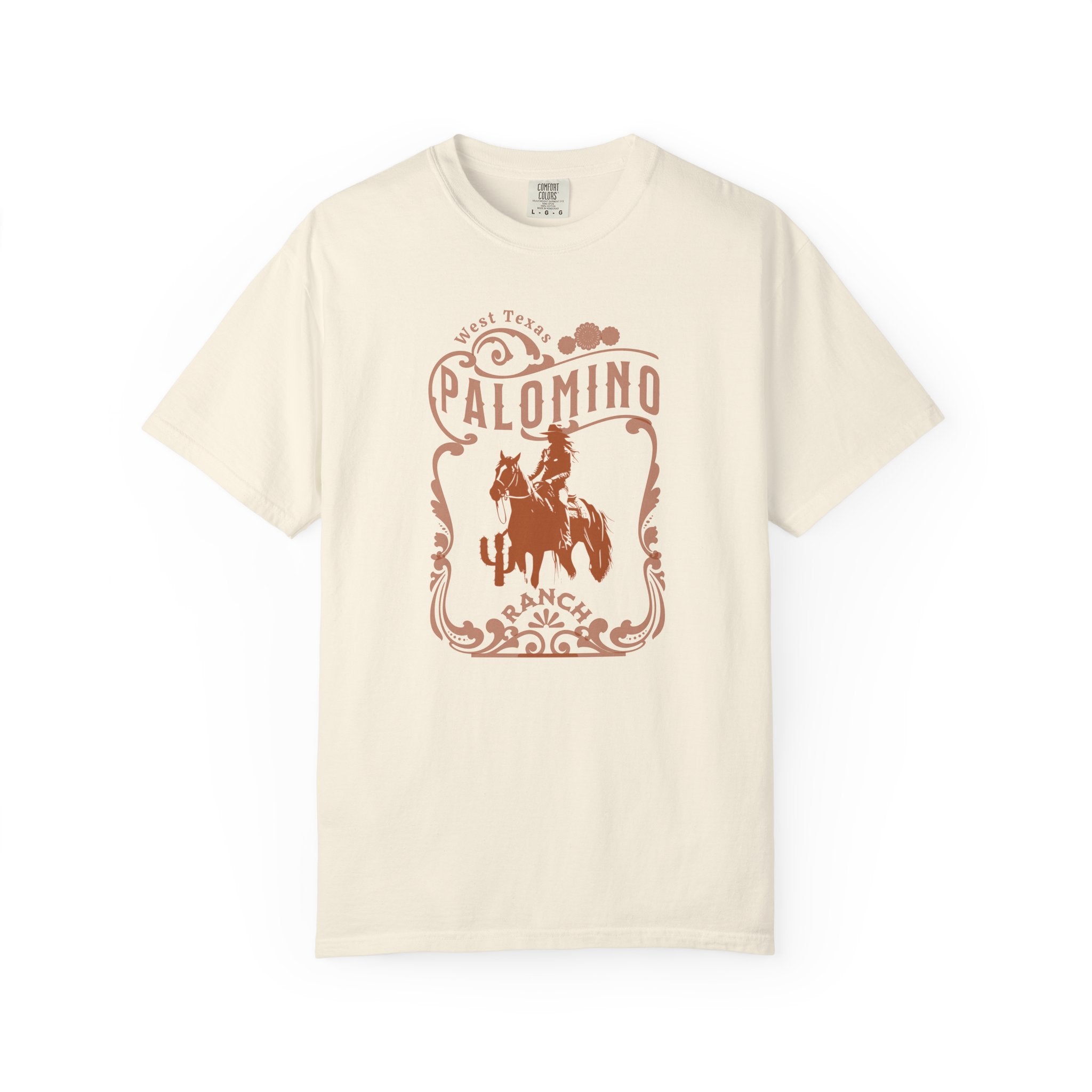 Ivory t-shirt with a graphic design of a horse and rider, and 'Palomino Ranch' text 