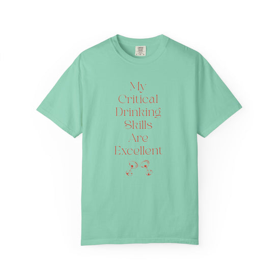 Blue short sleeve, crew neck t-shirt has text that says "My critical drinking skills are excellent" and  a graphic of two martini glasses.