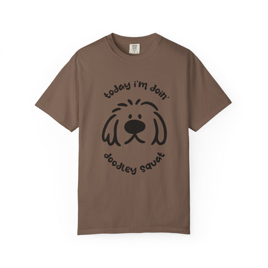 Brown hort-sleeve crewneck t-shirt featuring a black graphic of a dog's face with the text 'Today i'm Doin' Doodley Squat" displayed on a clean white background.