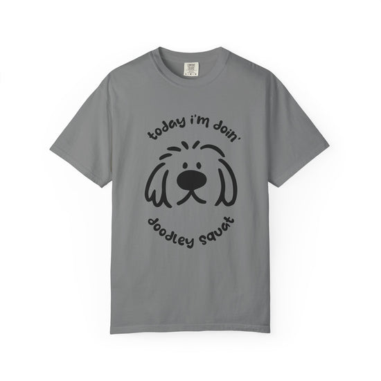 Grey short-sleeve crewneck t-shirt featuring a black graphic of a dog's face with the text 'Today i'm Doin' Doodley Squat" displayed on a clean white background.
