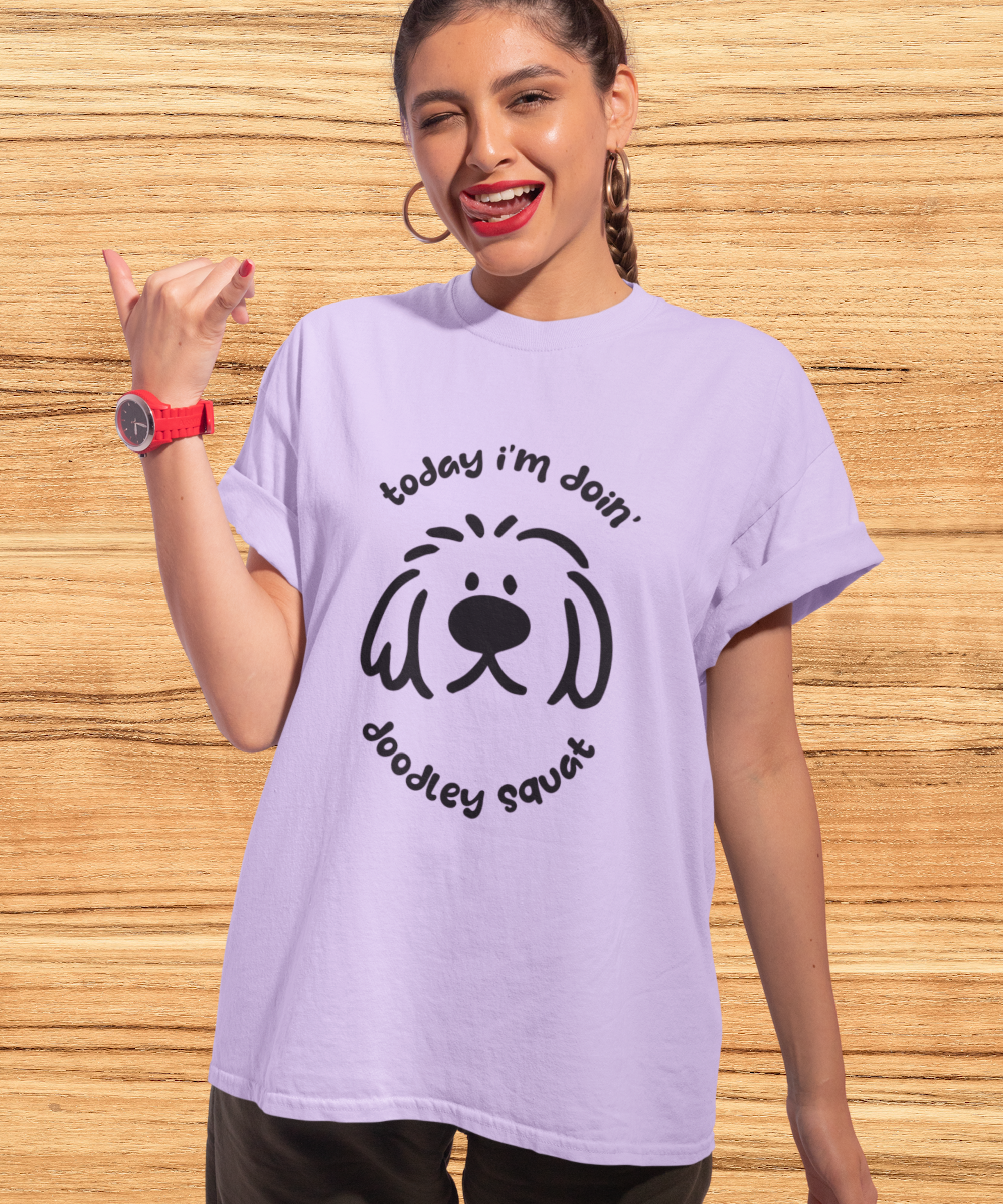 Purple short-sleeve crewneck t-shirt featuring a black graphic of a dog's face with the text 'Today i'm Doin' Doodley Squat" displayed on a clean white background.