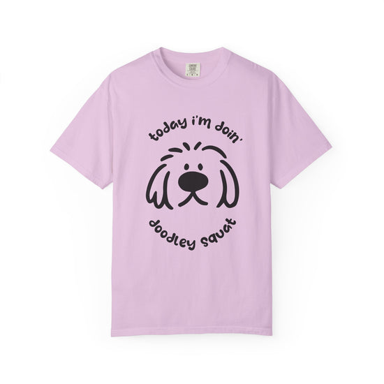 Purple  short-sleeve crewneck t-shirt featuring a black graphic of a dog's face with the text 'Today i'm Doin' Doodley Squat" displayed on a clean white background.