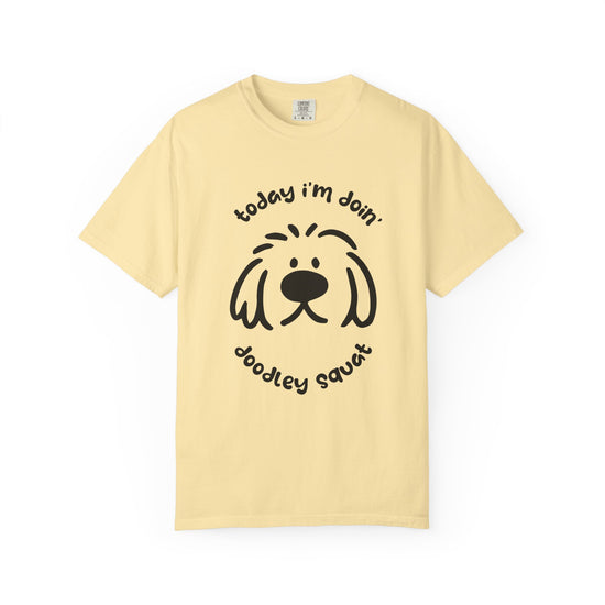 Yelllow short-sleeve crewneck t-shirt featuring a black graphic of a dog's face with the text 'Today i'm Doin' Doodley Squat" displayed on a clean white background.