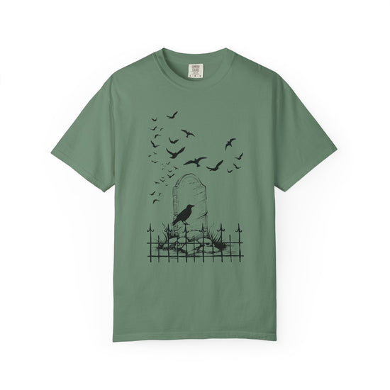 Green short sleeve, crew neck t-shirt from Comfort Colors as graphic of a graveyard with crows.