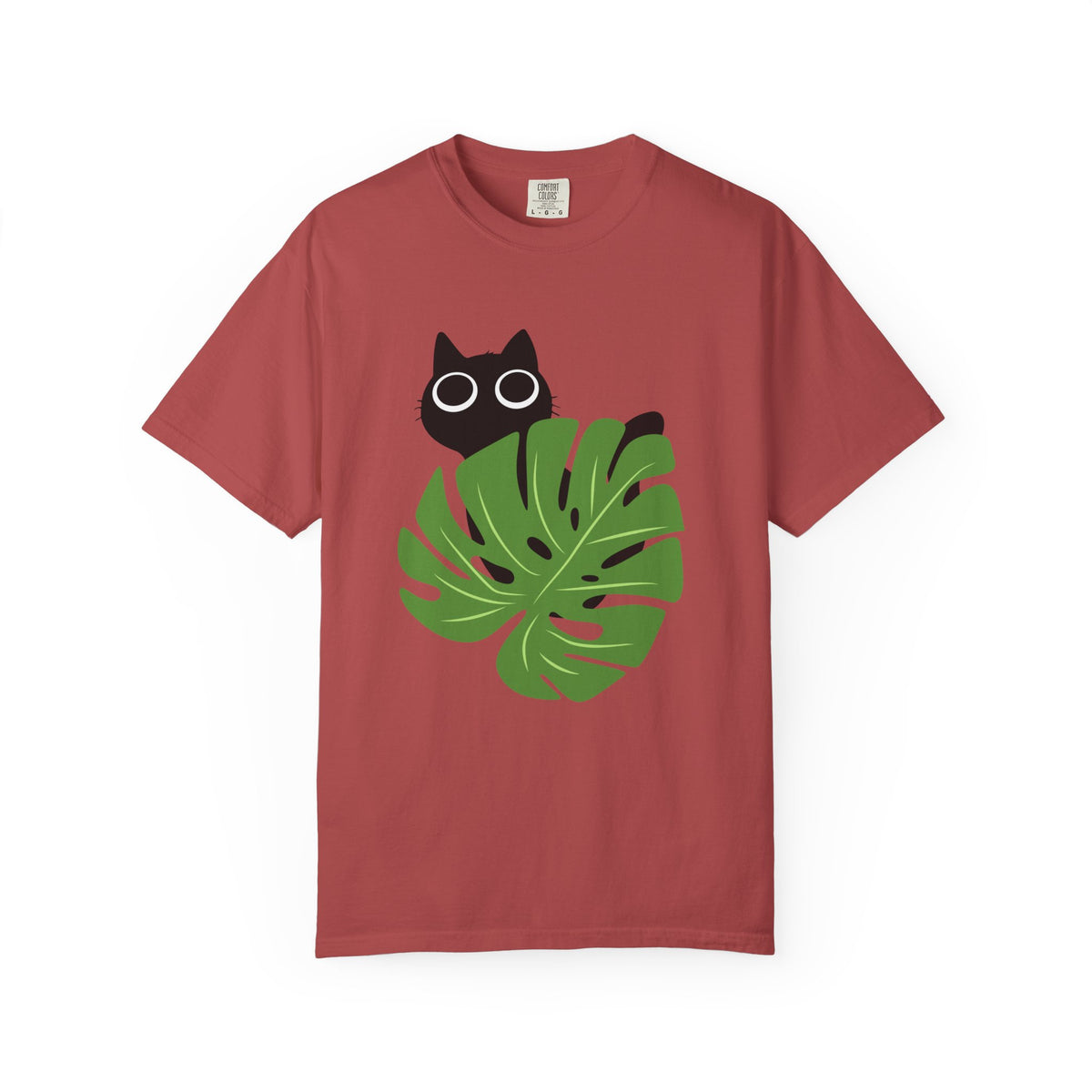 Red short-sleeve crewneck t-shirt featuring a graphic of a black cat peeking over a green monstera leaf with white-rimmed glasses, displayed on a clean white background.