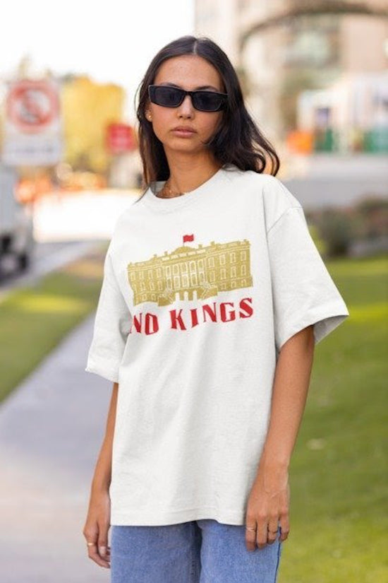 White T-shirt with gold white house says "No Kings"  in red.