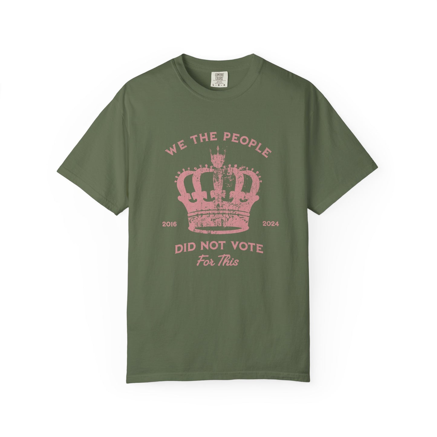 Green t-shirt with pink text and crown graphic and text says 'No Kings'