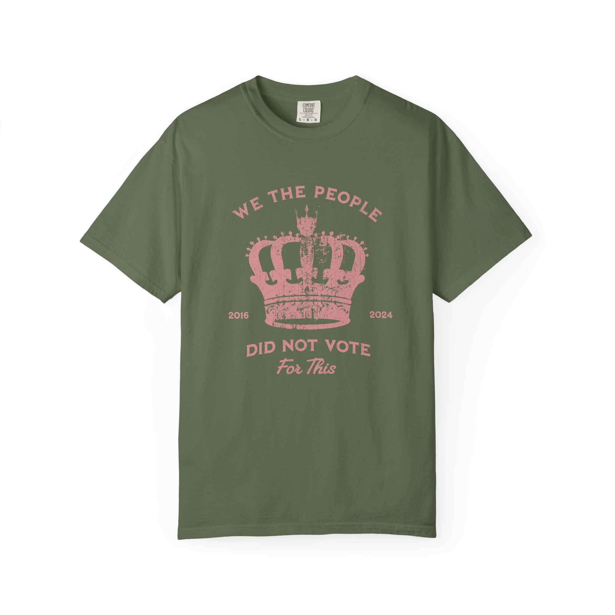 Green t-shirt with pink text and crown graphic and text says 'No Kings'