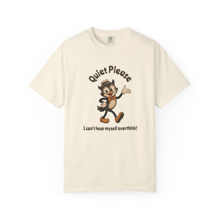 An off-white short-sleeve t-shirt with a vintage-style cartoon graphic of an owl wearing a hat and bow tie, accompanied by the text 'Quiet Please' above and 'I can't hear myself overthink!' below.