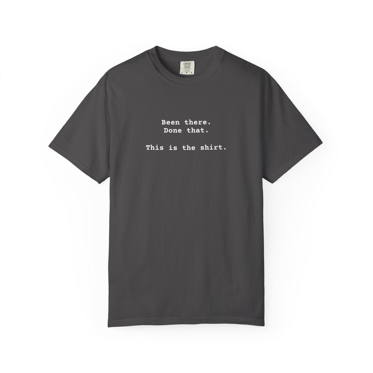 Vintage black t-shirt with text on a white background says "Been There.  Done That.  Here's The T-shirt" in a simple typewriter font