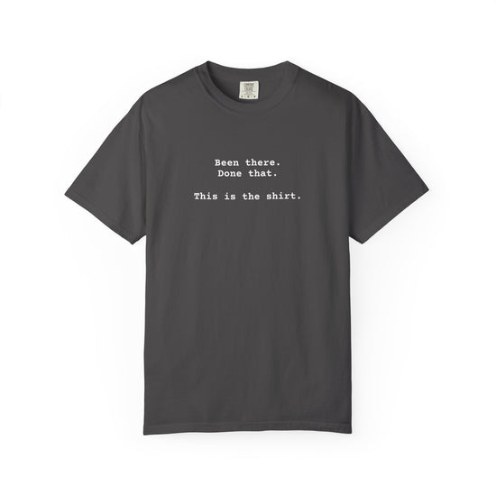 Vintage black t-shirt with text on a white background says "Been There.  Done That.  Here's The T-shirt" in a simple typewriter font