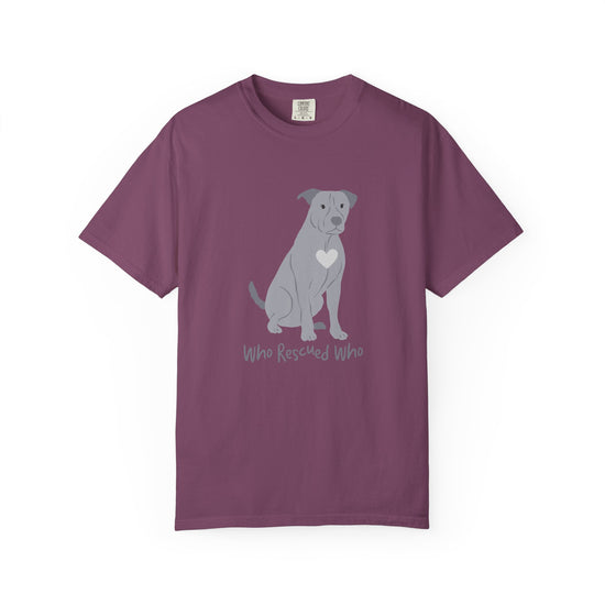 Purple short-sleeve crewneck t-shirt featuring a graphic of a pit bull dog with a white heart on its chest sitting and the text 'Who Rescued Who' printed below it.