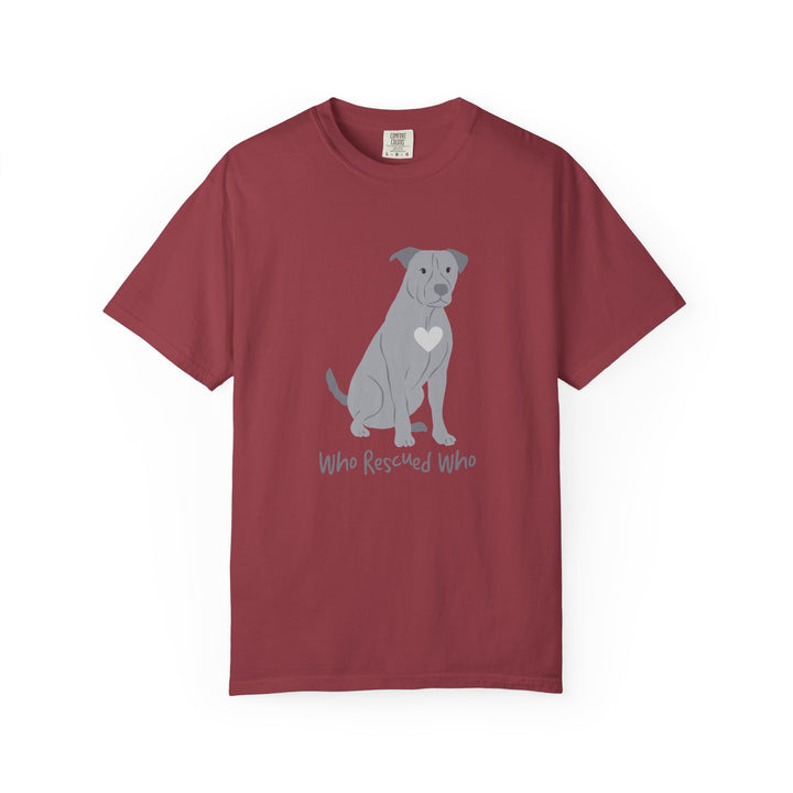 Red short-sleeve crewneck t-shirt featuring a graphic of a pit bull dog with a white heart on its chest sitting and the text 'Who Rescued Who' printed below it.