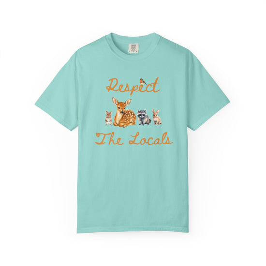 Blue short-sleeve crewneck t-shirt featuring a graphic print of a fawn, a raccoon, and a rabbit under the text 'Respect The Locals' in orange-brown script.