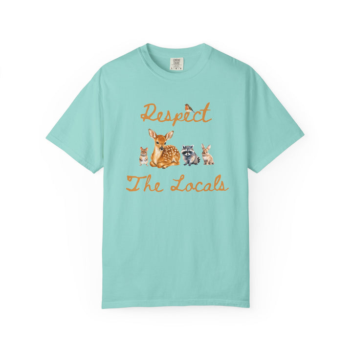 Blue short-sleeve crewneck t-shirt featuring a graphic print of a fawn, a raccoon, and a rabbit under the text 'Respect The Locals' in orange-brown script.