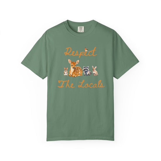 Green short-sleeve crewneck t-shirt featuring a graphic print of a fawn, a raccoon, and a rabbit under the text 'Respect The Locals' in orange-brown script.