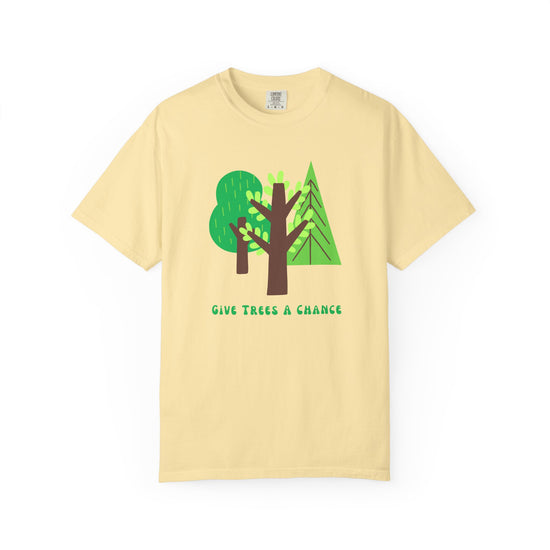 Yellow t-shirt with green trees graphic and 'Give Trees a Chance' text 