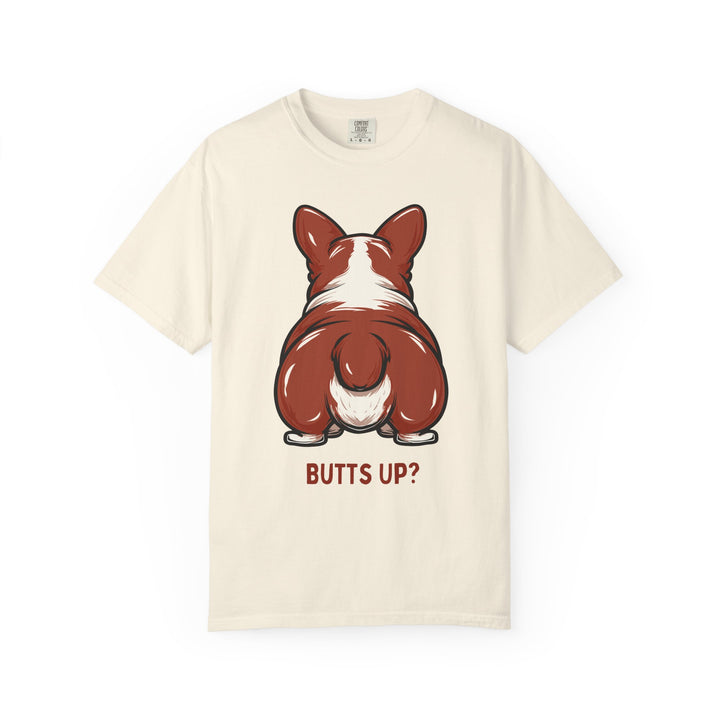 Off white cotton t-shirt has cartoon of Welsh Corgi's butt and text that says "Butts Up?"