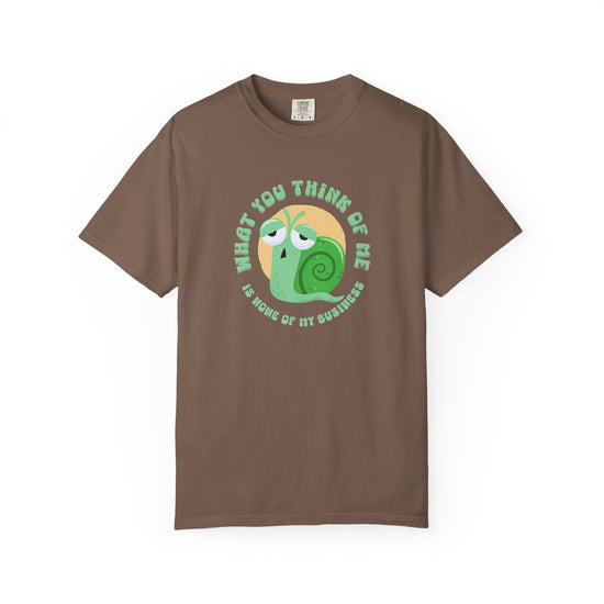 Brown short-sleeve crewneck t-shirt featuring a cartoon graphic of a green snail inside a yellow circle, with the text 'WHAT YOU THINK OF ME IS SOME OF MY BUSINESS' printed around it.