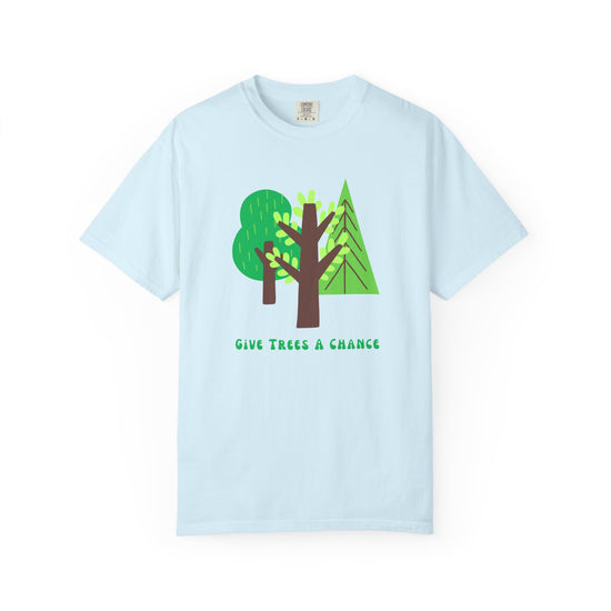 Light blue  t-shirt with green tree graphic and text says "GIve Trees A Chance."